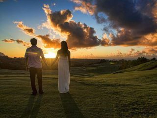 Couple holding hands in Kauai