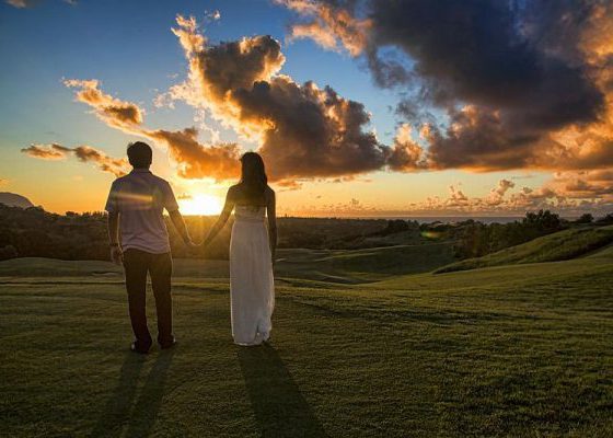 Couple holding hands in Kauai